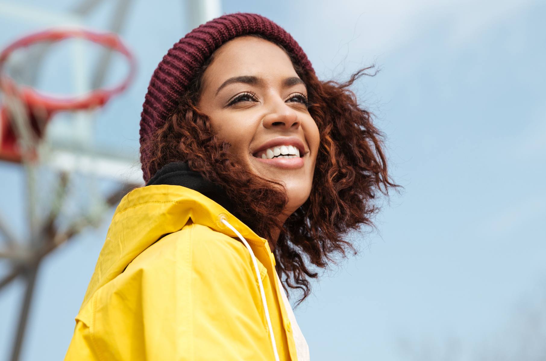 Woman on basketball court smiling