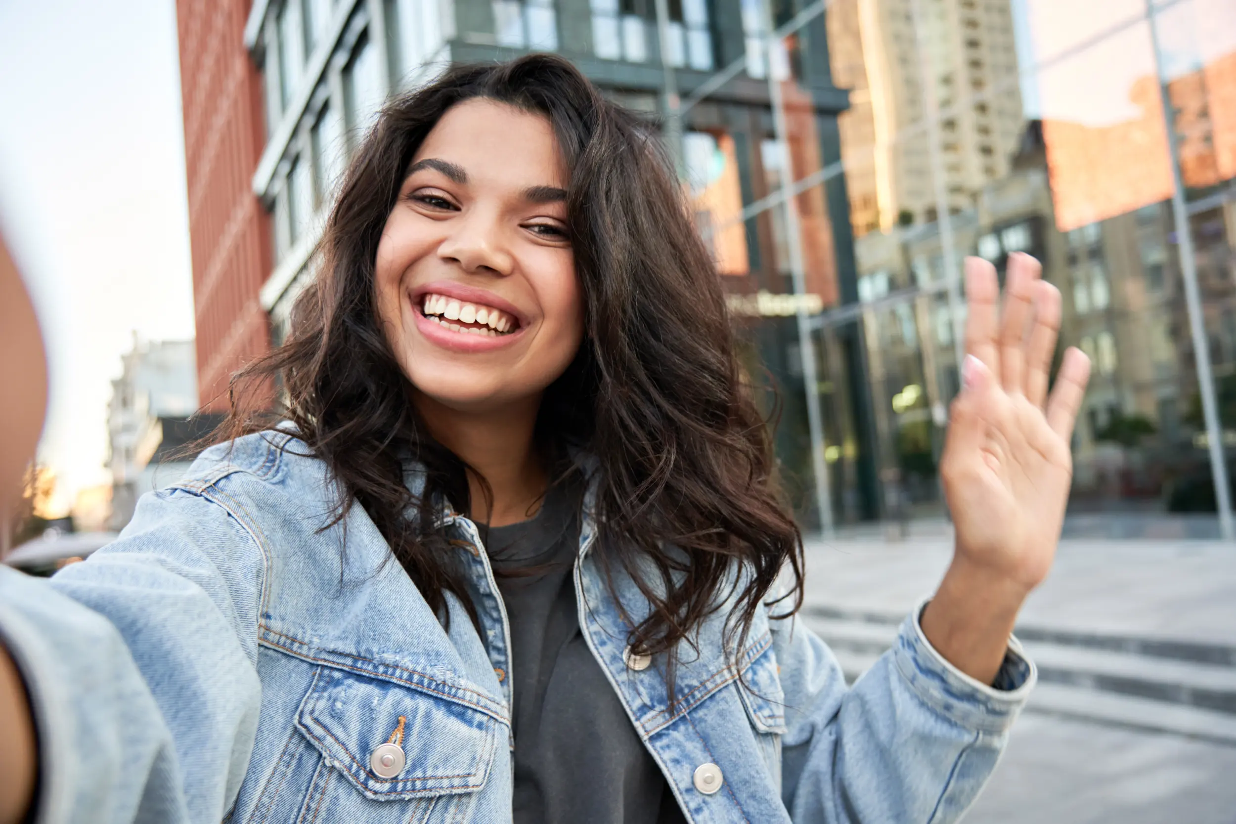 Woman smiling and waving